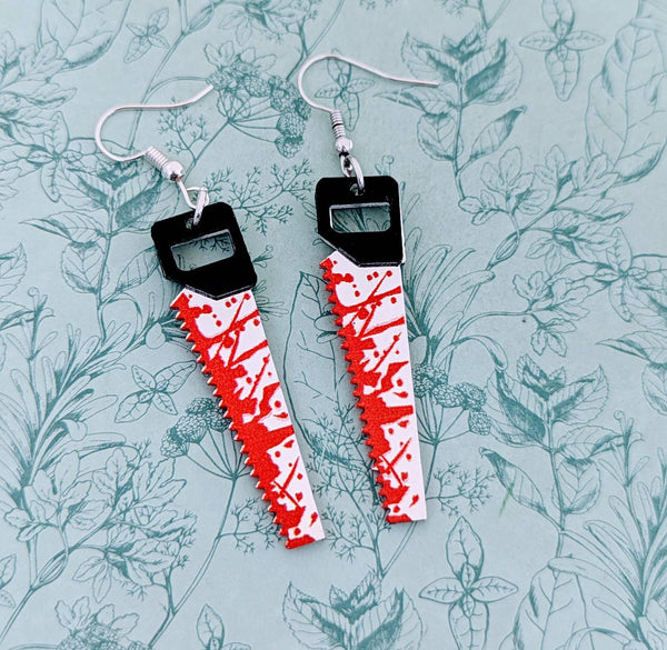 Saw earrings, horror earrings, Halloween earrings, horror film lovers, horror inspired gifts, Halloween inspired gifts, gothic earrings,